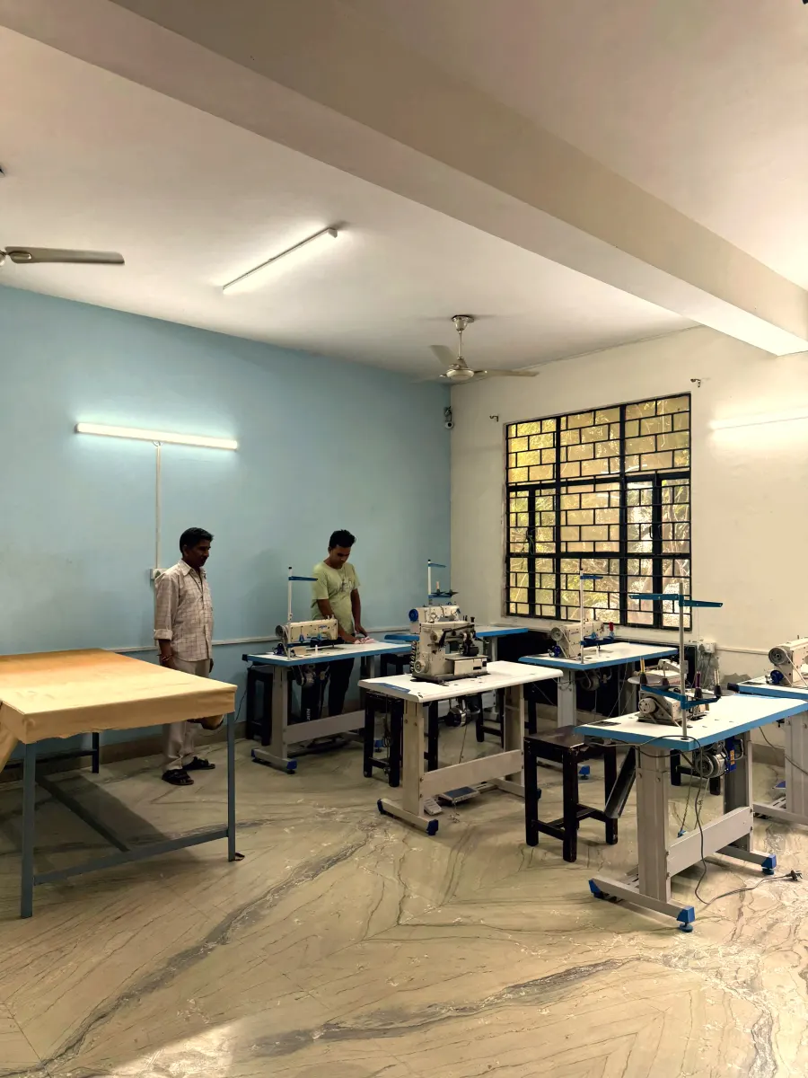 Sewing floor overview with workers at multiple stitching stations