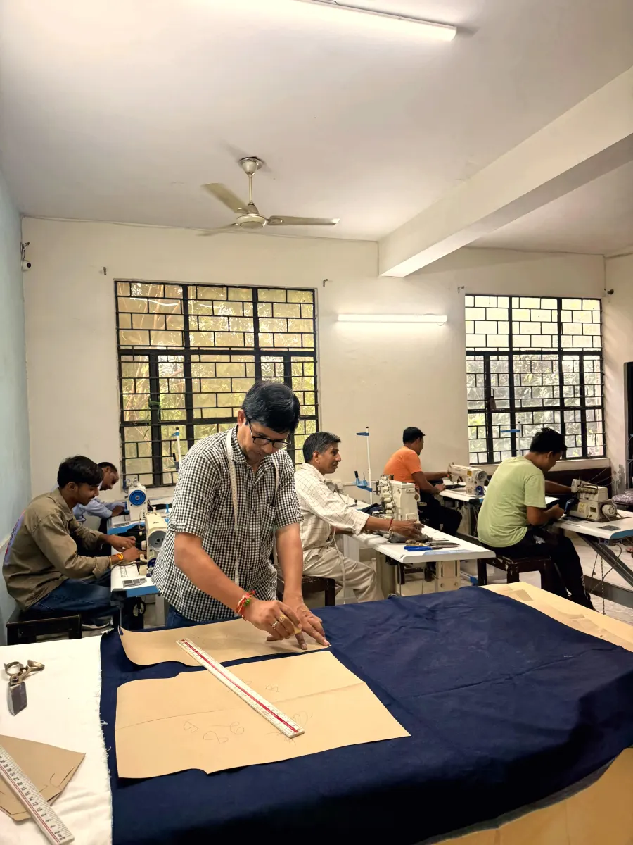 A pattern being marked and cut on the cutting table