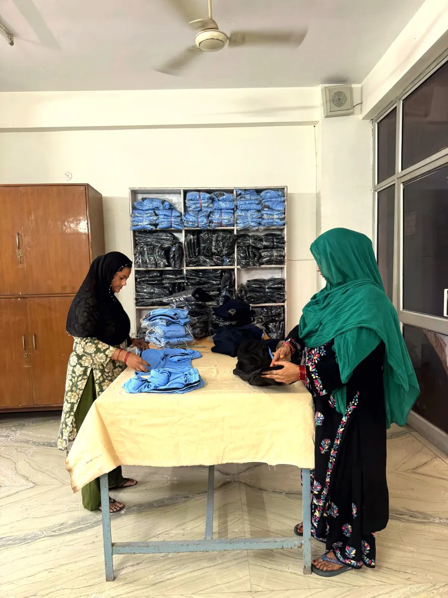 Staff folding and quality-checking finished garments